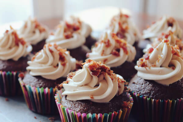 Cupcakes with cream and nuts on the top