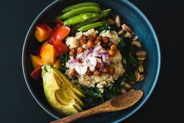 Salad bowl with avocado, beans and nuts